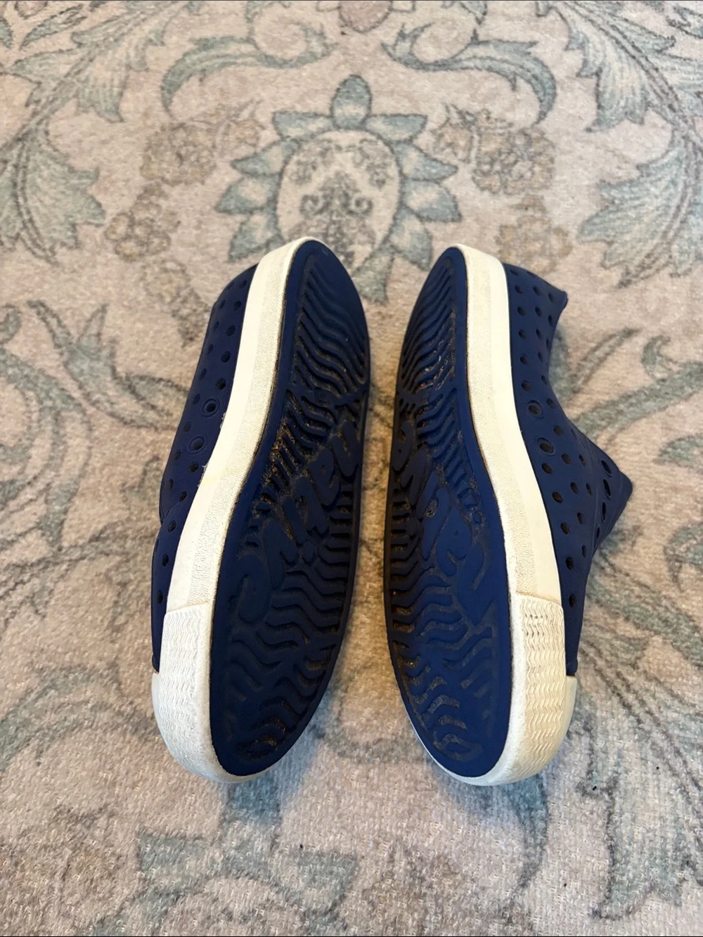 Navy blue boys Native shoes.
